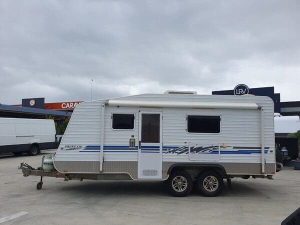 990<br>2010 BILLABONG GROVE 17'6 DUAL AXLE TOURING CARAVAN<br><br>WEIGHTS<br>TARE - 1960KG<br>GTM - 2175KG<br>ATM - 2360KG<br>BALL - 185KG<br>PAYLOAD - 400KG<br>LENGTHS<br>17'6 - INTERNAL<br>19' - EXTERNAL<br>25'3 - OVERALL (TRAVEL)<br><br>EXTERNAL FEATURES<br>4 A Frame<br>4 Chassis <br>All Terrain tyres<br>Leaf Spring Suspension<br>Drop down Stabiliser legs<br>50mm Ball coupling<br>12 pin flat trailer plug<br>Grey Anderson plug - charges caravan house batteries while driving <br>2 x 9kg Gas bottles<br>gas/electric Hot Water system<br>Roll out awning<br>picnic table <br>2 fresh water tanks<br>Full through tunnel boot<br>External Awning light<br>Tri-lock crim safe entry door.<br>Entry Grab Handle<br>External 12v socket