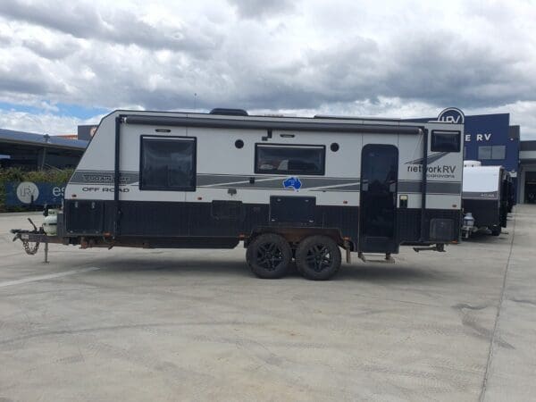 990<br>2021 NETWORK RV TERRAIN TUFF OFF ROAD 22' TRIPLE BUNK FAMILY CARAVAN<br><br>WEIGHTS<br>TARE - 2613KG<br>ATM - 3300KG<br>PAYLOAD - 687KG<br>BALL - 189KG<br><br>LENGTHS<br>INTERNAL - 22'<br>EXTERNAL - 23'<br>OVERALL - 29'<br><br>EXTERNAL FEATURES<br>DO35 Coupling Hitch<br>6 A Frame<br>6 Chassis<br>Black Jack Jockey Wheel<br>Toolbox<br>2 x 9kg Gas Bottles<br>12 pin flat plug<br>Grey Anderson Plug<br>Diesel Heater<br>Gas/Electric Hot Water System<br>Stabiliser Legs to each corner<br>Large Tunnel Boot<br>BBQ Slide in Tunnel Boot<br>Picnic Table <br>External TV points<br>2 x External lights with bug lights<br>2 external Speakers<br>Pull out Manual Awning with Centre Support Bracket<br>Large Double Glazed Windows<br>3 x Solar panels<br>3 x Batteries<br>Dometic Dust Reduction System<br>Independent Coil Suspension<br>265/75/18 LT tyres<br>18 Alloy Wheels<br>4 Bike rack<br>2 x Jerry Can Holders<br>Spare Wheel<br>4 Arm Rear Bar<br>Reverse Camera - Car Kit not included<br>Manual Pull Out Step<br>Entry Grab Handle<br>Crimsafe Tri Lock Main Door<br>100L Grey Water Tank<br>2 x 95L Fresh Water Tanks<br>2 x 9KG Gas Bottles<br><br>INTERNAL FEATURES<br>Entry grab Handle<br>IBIS 4 Split System Air Conditioner<br>Full Ensuite with Separate Toilet and Shower<br>Large Easy access Shower with 12v Exhaust fan<br>Ceramic Bowl Toilet with Exhaust Fan<br>12V Isolation Switch<br>6 Sirocco Fans (2 bed