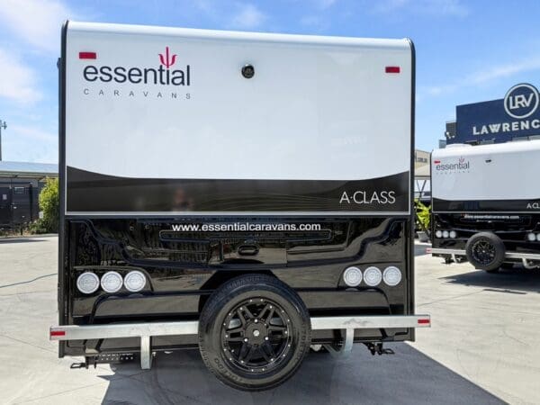  the A-Class is a sleek looking unit. <br>Standard Lithium and solar means the A-Class is your gateway to limitless <br>exploration.<br><br>WEIGHTS<br>Tare: 2149 Kg<br>GTM: 2608 Kg<br>ATM: 2799<br>Kg<br>Ball: 191 Kg<br><br>CHASSIS<br>- 6” Heavy Duty A-frame<br>- <br>A-Frame Tap & Gas Regulator<br>- Straight Axles to Single & Tandem <br>axle<br>- 10” Electric Brakes to Tandem Axle<br>- 12” Electric Brakes to Single <br>Axle<br>- 4” Heavy Duty Chassis<br>- 2” Chassis Raiser <br>- 50mm Ball <br>Coupling<br>- Lockable Coupling with Twin Safety Chains<br>- Wind Up Jack<br>- <br>8” Jockey Wheel<br>- Spare Wheel<br>- Drop Down Stabilizer Stands<br>- Batteries <br>Mounted on Chassis<br>- Water Tank Stoneguards<br>- Load Share Leaf Spring <br>Suspension<br>- Break Away System<br>- Heavy Duty 2 Arm Bumper<br>- Plastic <br>moulded Wheel Spats<br><br>ELECTRICAL<br>- Mini Grill with 3 Burner Gas & 1 <br>240V Element<br>- Pot Drawer<br>- Microwave in OHC<br>- 2-way switch from <br>bedroom to Ensuite lights<br>- Projecta PM235C 30A Battery Management System <br><br>- 4” LED Monitoring Screen<br>- 1 x 300AH Lithium Battery Chassis <br>Mounted<br>- 2 x 220W Solar Panels<br>- Bug Annexe Light<br>- External TV <br>Bracket<br>- 12V/USB Socket & TV Point at Outside Table<br>- 240V 15AMP <br>Inlet & 240V 10AMP Outlet<br>- Double 240V Point & USB Point to each <br>Wardrobe & Lounge<br>- Roof Digital TV Antenna<br>- Bulk Heads With Strip <br>Lights<br>- Reversing Camera & Car Monitor Kit<br>- Circuit Breaker & <br>Earth Leakage<br>- Door Light & Entry Handle<br>- LED External Lights<br>- <br>LED Lighting - Roof