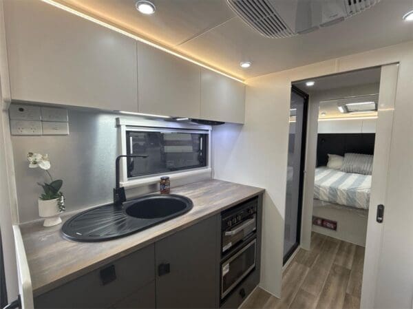  this caravan is ideal for couples who enjoy touring the country together. The rear door design provides easy access to all of your gear